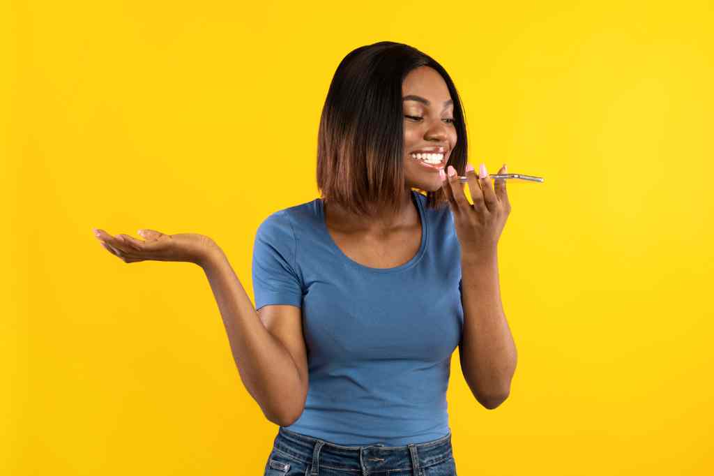 African American Woman Using Voice Search On Mobile Phone